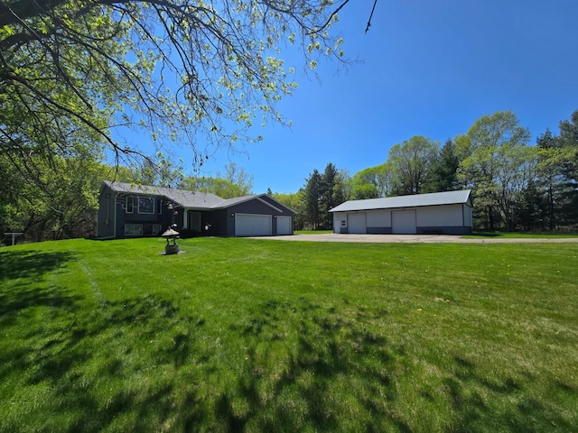 11170 207th Ave NW, Elk River, MN 55330 - view of green lawn featuring a detached garage