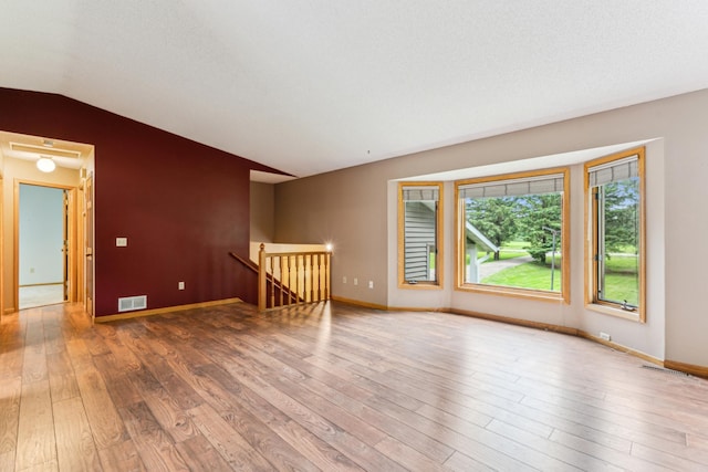 11170 207th Ave NW, Elk River, MN 55330 - unfurnished room with vaulted ceiling and wood finished floors