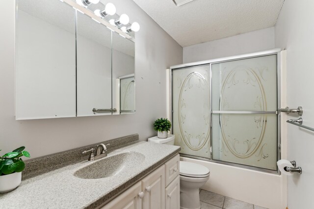 11170 207th Ave NW, Elk River, MN 55330 - bathroom featuring vanity, shower / bath combination with glass door, tile patterned floors, and a textured ceiling