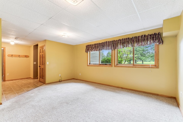 11170 207th Ave NW, Elk River, MN 55330 - empty room with carpet flooring, tile patterned floors, and a drop ceiling