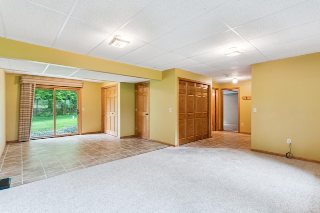 11170 207th Ave NW, Elk River, MN 55330 - carpeted empty room with a drop ceiling and tile patterned flooring