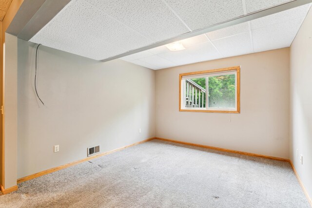 11170 207th Ave NW, Elk River, MN 55330 - spare room featuring carpet and a paneled ceiling