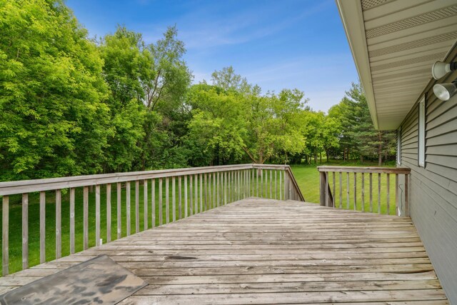 11170 207th Ave NW, Elk River, MN 55330 - wooden deck featuring a lawn and view of wooded area
