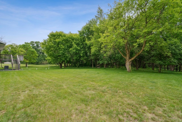 11170 207th Ave NW, Elk River, MN 55330 - view of grassy yard featuring stairway and a deck