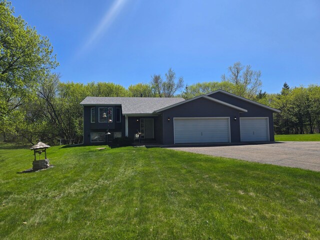11170 207th Ave NW, Elk River, MN 55330 - view of front of house featuring asphalt driveway, an attached garage, and a front yard