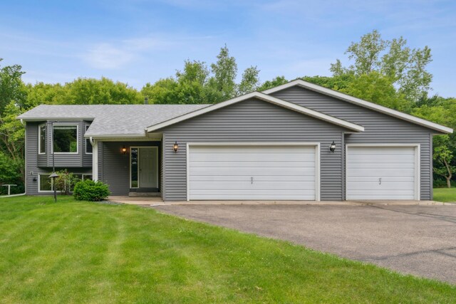 11170 207th Ave NW, Elk River, MN 55330 - split level home with a front lawn, roof with shingles, and an attached garage
