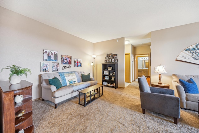 carpeted living room featuring baseboards