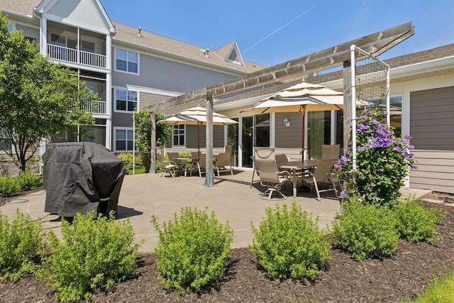 back of property featuring outdoor dining space and a patio