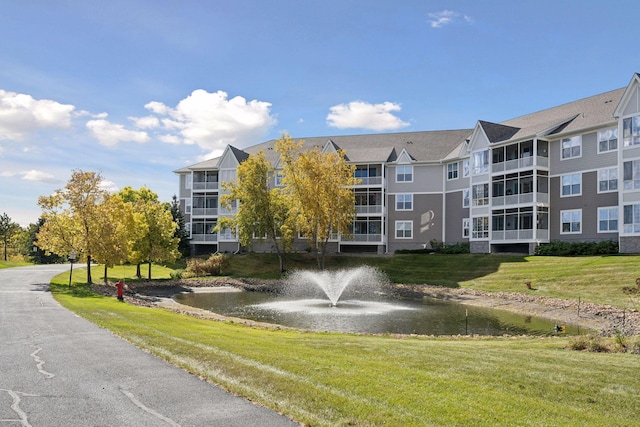 view of property with a water view