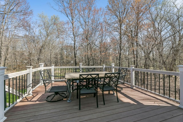 wooden terrace with outdoor dining space