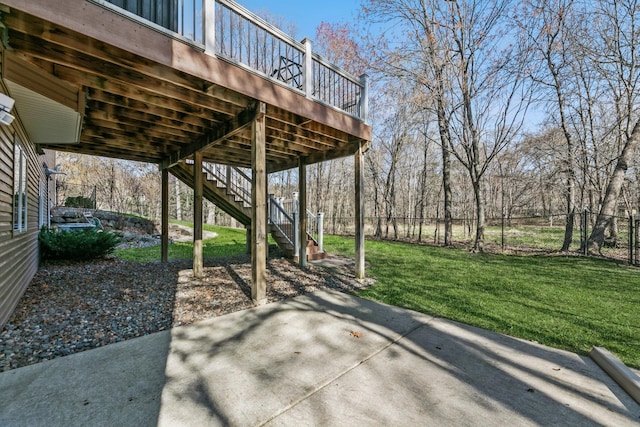 view of patio / terrace featuring stairs, fence, and a deck