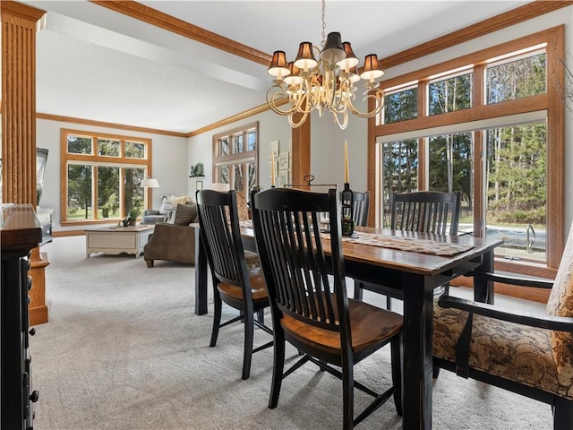 dining area with light colored carpet, a chandelier, and ornamental molding