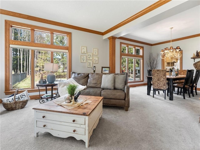 carpeted living room featuring crown molding and a notable chandelier