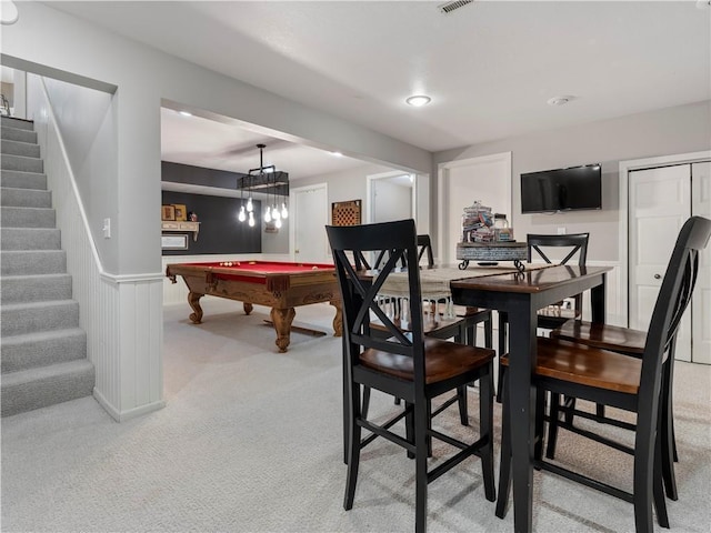interior space featuring a wainscoted wall, visible vents, light carpet, and pool table