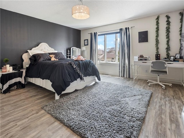 bedroom featuring wood finished floors
