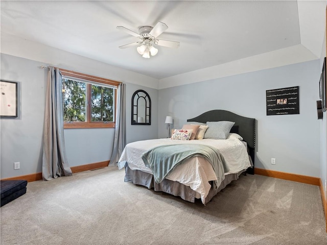bedroom featuring a ceiling fan, carpet, and baseboards