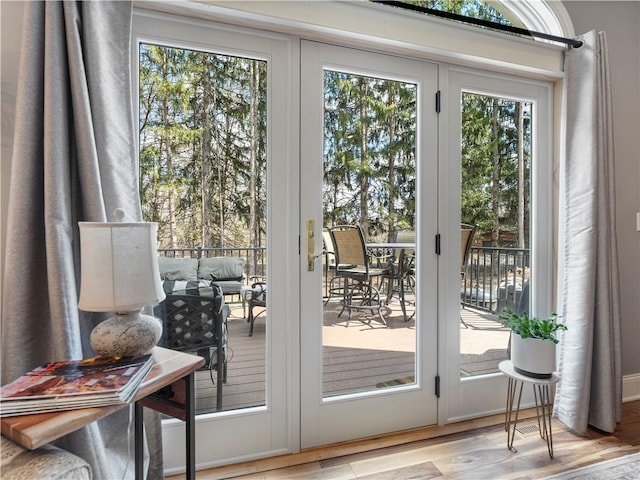 doorway to outside featuring wood finished floors and french doors