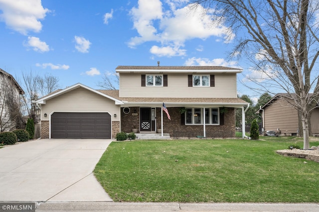 traditional home featuring concrete driveway, a front yard, an attached garage, and brick siding