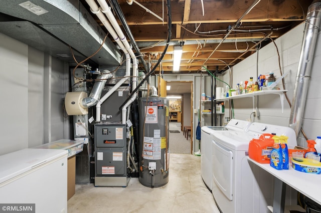 unfinished below grade area with white refrigerator, heating unit, gas water heater, and washing machine and clothes dryer