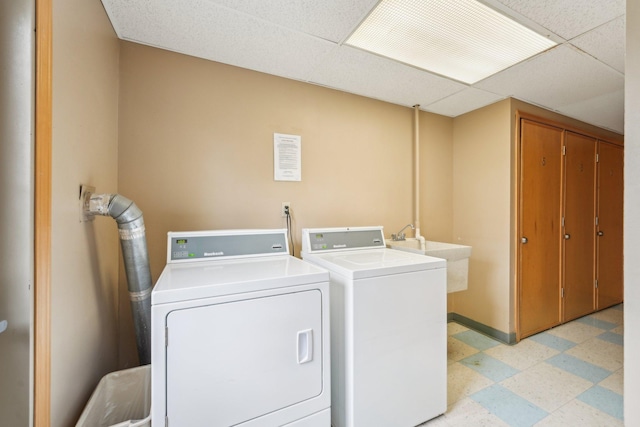 4654 Cedar Lake Rd S Unit 6, Saint Louis Park, MN 55416 - laundry area featuring baseboards, a sink, light floors, and independent washer and dryer