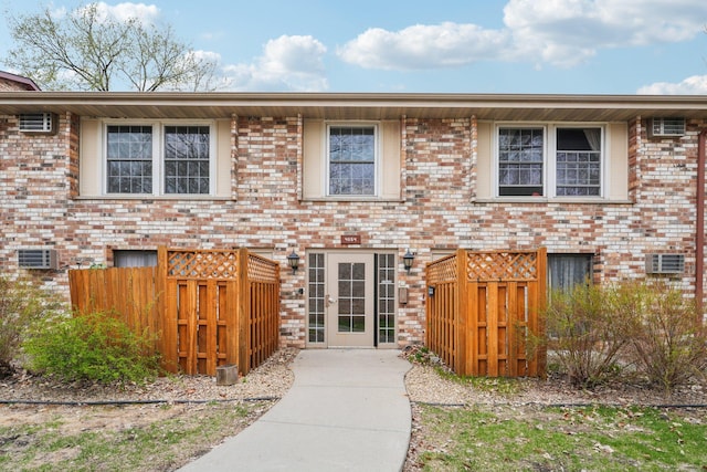 4654 Cedar Lake Rd S Unit 6, Saint Louis Park, MN 55416 - view of front of house featuring brick siding and fence