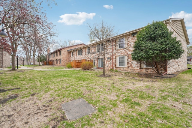 4654 Cedar Lake Rd S Unit 6, Saint Louis Park, MN 55416 - back of property featuring a yard and brick siding