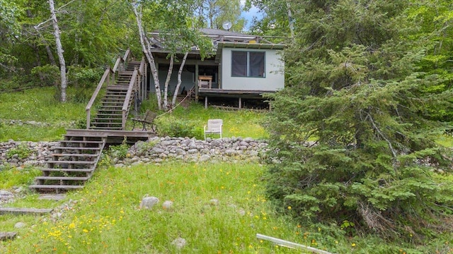 95536 Pine Is, Greenwood Twp, MN 55790 - view of yard featuring stairway and a wooden deck