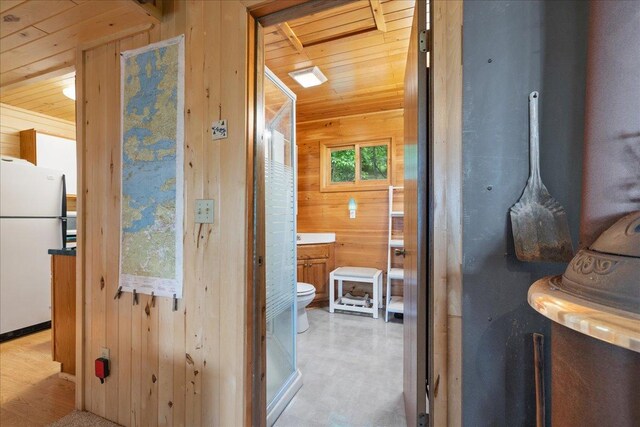 95536 Pine Is, Greenwood Twp, MN 55790 - bathroom with wooden walls, wood ceiling, and toilet