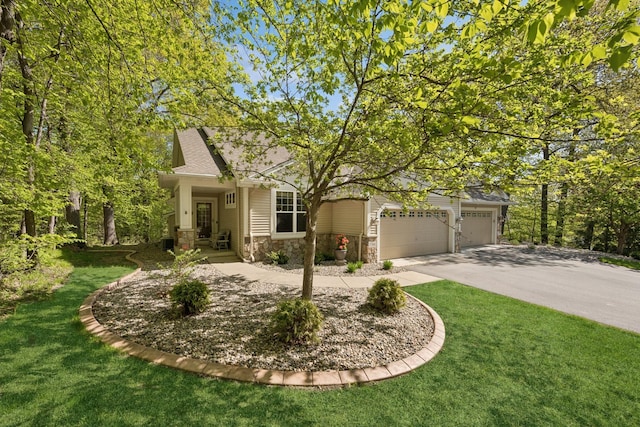 17300 Tilia Rdg, Eden Prairie, MN 55347 - obstructed view of property with stone siding, a garage, concrete driveway, a front lawn, and roof with shingles