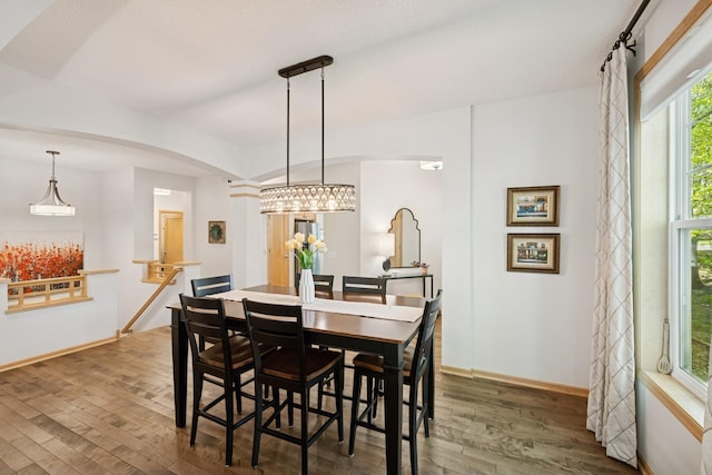 17300 Tilia Rdg, Eden Prairie, MN 55347 - dining space with wood finished floors, arched walkways, and baseboards