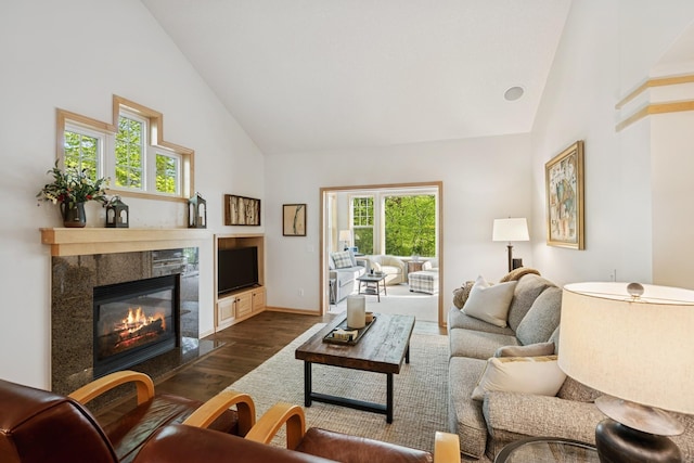 17300 Tilia Rdg, Eden Prairie, MN 55347 - living area featuring high vaulted ceiling, dark wood-style floors, a tiled fireplace, and baseboards