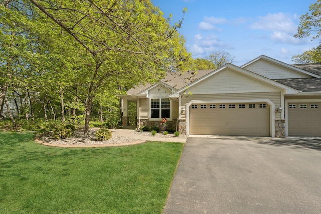 17300 Tilia Rdg, Eden Prairie, MN 55347 - view of front of house featuring stone siding, asphalt driveway, an attached garage, and a shingled roof
