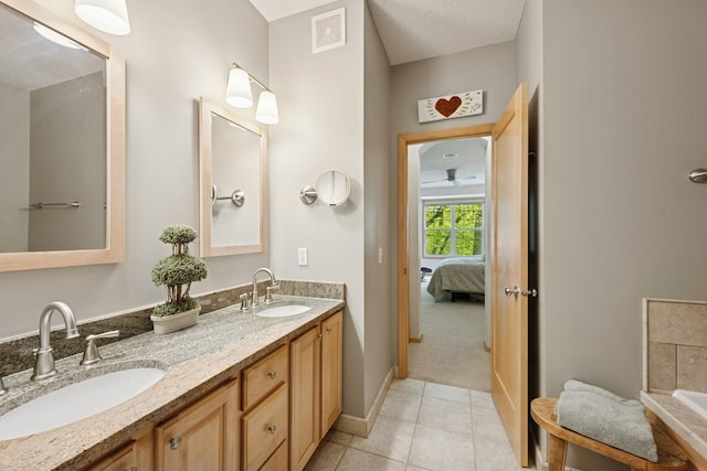 17300 Tilia Rdg, Eden Prairie, MN 55347 - full bathroom featuring double vanity, ensuite bathroom, and tile patterned floors