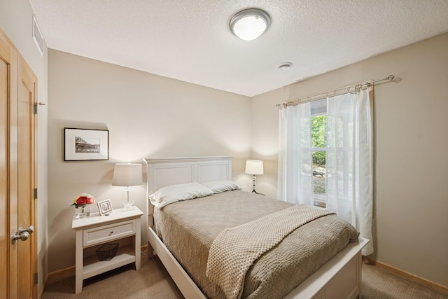 17300 Tilia Rdg, Eden Prairie, MN 55347 - bedroom with light colored carpet and a textured ceiling