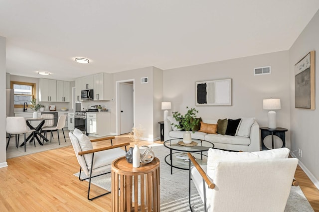 4836 Bloomington Ave, Minneapolis, MN 55417 - living area with light wood-type flooring and baseboards