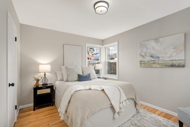 4836 Bloomington Ave, Minneapolis, MN 55417 - bedroom featuring baseboards and light wood finished floors