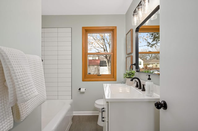 4836 Bloomington Ave, Minneapolis, MN 55417 - bathroom with vanity, toilet, baseboards, and tub / shower combination