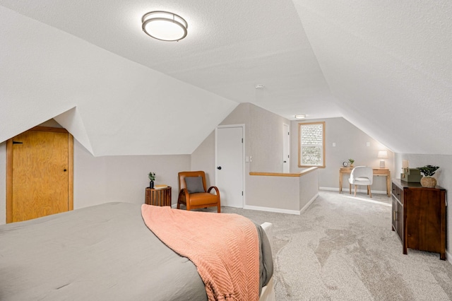 4836 Bloomington Ave, Minneapolis, MN 55417 - bedroom featuring light colored carpet, a textured ceiling, lofted ceiling, and baseboards