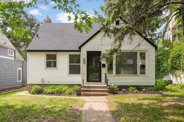 4836 Bloomington Ave, Minneapolis, MN 55417 - view of front facade featuring roof with shingles and a front lawn