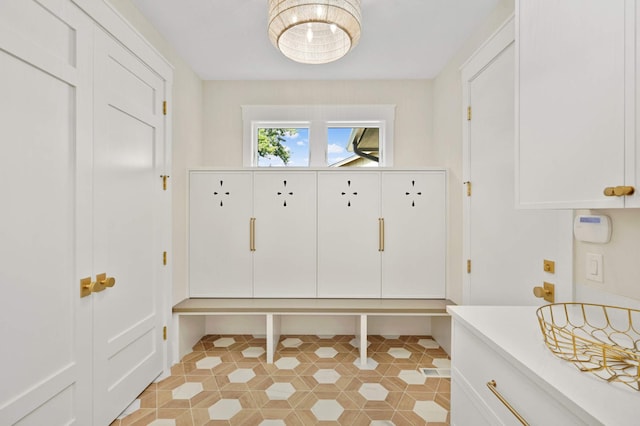 mudroom with light tile patterned floors