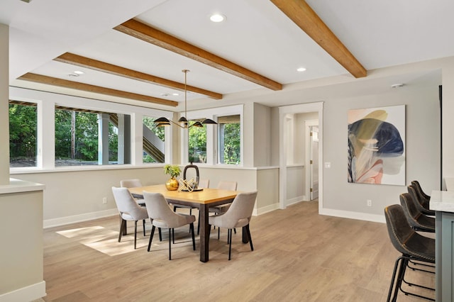 dining area featuring light wood-type flooring, recessed lighting, beamed ceiling, and baseboards