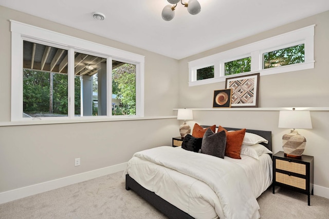 bedroom featuring carpet flooring and baseboards
