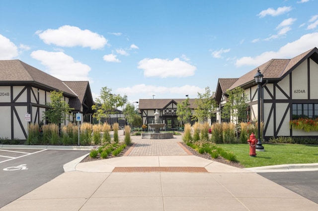 surrounding community with a lawn and a residential view