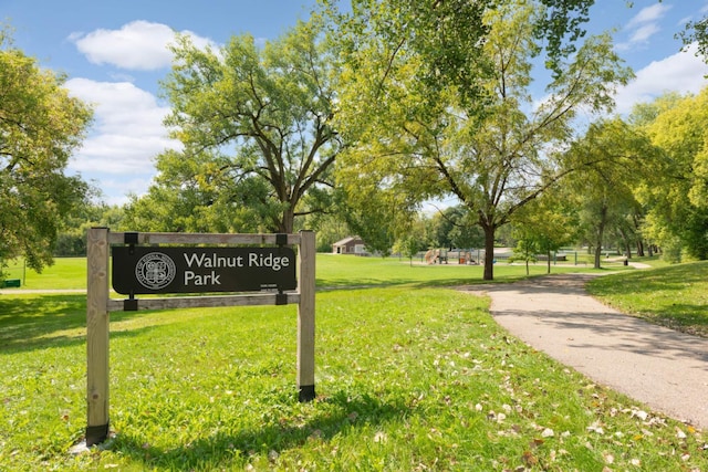 view of home's community with a yard