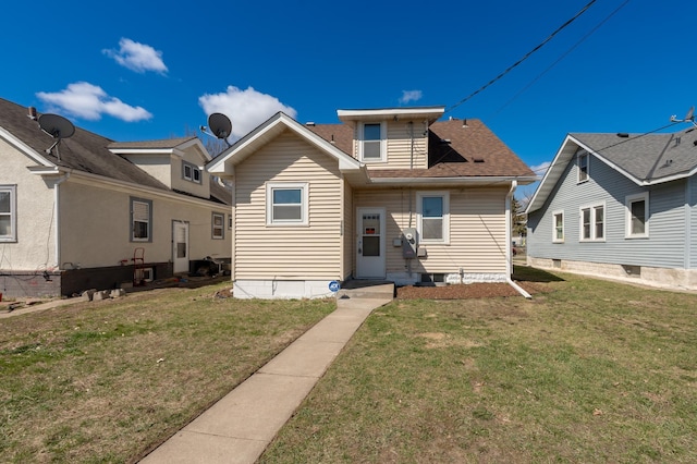 1634 Upton Ave N, Minneapolis, MN 55411 - back of property with a yard and a shingled roof