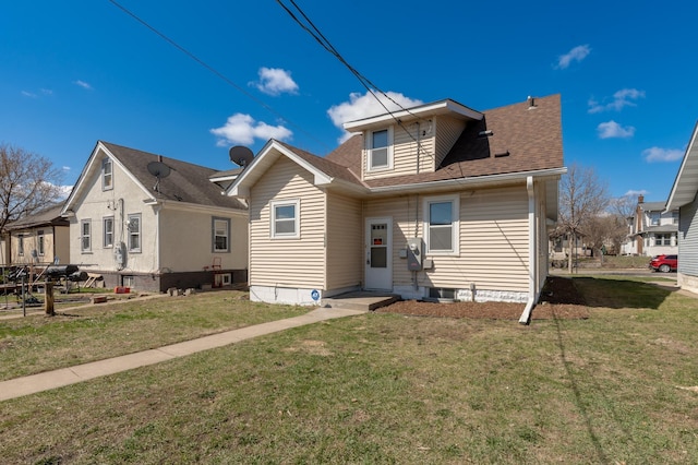 1634 Upton Ave N, Minneapolis, MN 55411 - rear view of property with a yard and a shingled roof