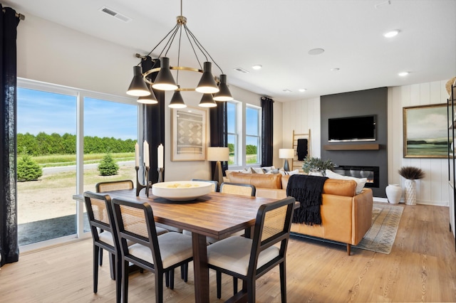 12514 Erskin St NE, Blaine, MN 55449 - dining space featuring visible vents, recessed lighting, a notable chandelier, and light wood-style floors