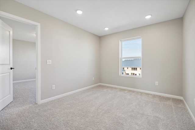 empty room with baseboards and carpet floors