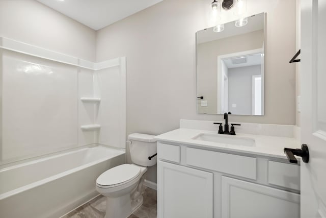 bathroom with toilet, vanity, and shower / bathing tub combination
