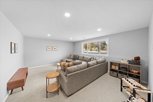 carpeted living room featuring baseboards and recessed lighting